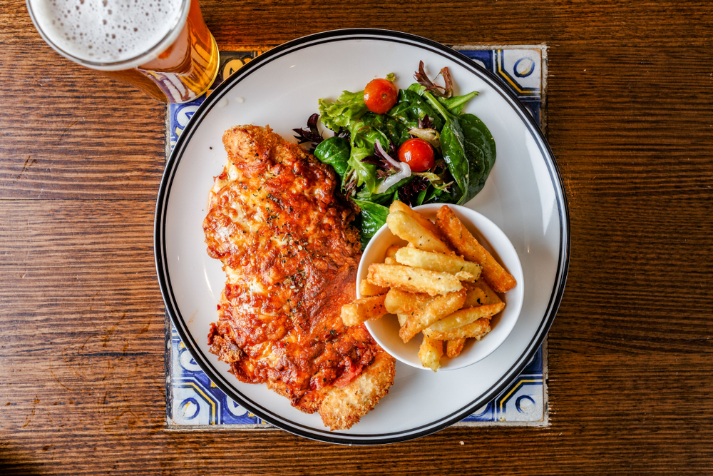 Flat,Lay,Of,Chicken,Parmigiana,,Bowl,Of,Chips,And,Green